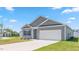 Charming single-Gathering home features a two-car garage, gray siding, and well-manicured lawn at 514 Lochalsh Dr, Gibsonville, NC 27249