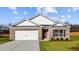 Charming single-story brick home with a two-car garage and well-maintained front lawn at 517 Lochalsh Dr, Gibsonville, NC 27249