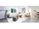 Bright living room with stylish decor, large windows, and hardwood-style floors at 517 Lochalsh Dr, Gibsonville, NC 27249