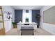 Spacious home office with modern desk, comfortable seating, and a calming gray accent wall at 517 Lochalsh Dr, Gibsonville, NC 27249