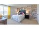 Vibrant bedroom showcasing a floral accent wall, a comfortable bed, and bright, cheerful decor at 522 Lochalsh Dr, Gibsonville, NC 27249
