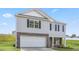 Charming two-story home with stone accents and attached two-car garage at 522 Lochalsh Dr, Gibsonville, NC 27249