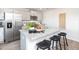 Stylish kitchen featuring stainless steel appliances, granite countertops, and seating at the island at 522 Lochalsh Dr, Gibsonville, NC 27249