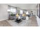 Open-concept living room connected to modern kitchen and dining space at 522 Lochalsh Dr, Gibsonville, NC 27249