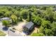 An aerial shot showcases this property near lush greenery and a neighborhood street, offering both seclusion and convenience at 528 1/2 Bragg St, Raleigh, NC 27610