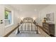 Inviting bedroom with a metal bed frame, gray nightstands, and stylish decor, creating a cozy and relaxing retreat at 528 1/2 Bragg St, Raleigh, NC 27610