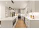 Elegant kitchen with white cabinets, subway tile backsplash, and stainless-steel appliances, providing a modern design at 528 1/2 Bragg St, Raleigh, NC 27610