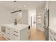 Bright and modern kitchen with white cabinetry, stainless steel appliances, and a stylish island with seating at 528 1/2 Bragg St, Raleigh, NC 27610