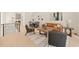 Bright open-concept living room and dining area with contemporary decor, wood floors, and lots of natural light at 528 1/2 Bragg St, Raleigh, NC 27610