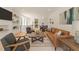 Inviting living space with modern furnishings, including sofa, chairs, rug, and art, that creates a stylish ambiance at 528 1/2 Bragg St, Raleigh, NC 27610