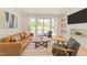 Cozy living room with modern decor, comfortable seating and sliding glass doors to deck at 528 1/2 Bragg St, Raleigh, NC 27610