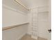 Walk-in closet features ample shelving and rod space for easy organization at 528 1/2 Bragg St, Raleigh, NC 27610