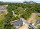 Home aerial view with the city skyline and mature trees in the background at 528 Bragg St, Raleigh, NC 27610