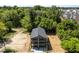 Aerial view of a modern home with lush green trees in the surrounding neighborhood at 528 Bragg St, Raleigh, NC 27610