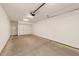 Basement garage featuring ample space for storage, with a finished concrete floor, and storage closet at 528 Bragg St, Raleigh, NC 27610