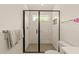 Bright bathroom features glass enclosed shower, toilet, and towel bar at 528 Bragg St, Raleigh, NC 27610
