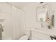 Clean, bright bathroom featuring a white vanity, modern fixtures, and a tiled shower at 528 Bragg St, Raleigh, NC 27610