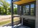 Modern home featuring a balcony with iron railings, contemporary design, and garage at 528 Bragg St, Raleigh, NC 27610