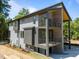 Side view of a contemporary home featuring multi-level balconies and modern architectural design at 528 Bragg St, Raleigh, NC 27610