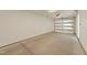 Spacious garage features an overhead door with windows, ample room for storage, and concrete floors at 528 Bragg St, Raleigh, NC 27610