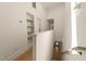Hallway view showing hardwood floors and shelving units in a brightly lit home at 528 Bragg St, Raleigh, NC 27610