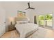 Inviting main bedroom with vaulted ceiling, ceiling fan, and sliding door leading to a balcony at 528 Bragg St, Raleigh, NC 27610