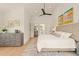 Serene main bedroom with plush bedding, hardwood floors, and tasteful decor for relaxation at 528 Bragg St, Raleigh, NC 27610