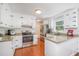 Modern kitchen with stainless steel appliances, granite countertops, and white subway tile backsplash at 5312 Hallmark Rd, Durham, NC 27712