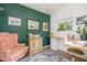 Cozy office space with a charming chair, a desk, a window, and stylish decor at 5312 Hallmark Rd, Durham, NC 27712