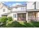 Lush green backyard with a large screened-in porch and patio for outdoor enjoyment at 5912 Hourglass Ct, Raleigh, NC 27612