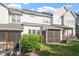 Well-maintained backyard with a screened-in porch, mature trees, and lush lawn at 5912 Hourglass Ct, Raleigh, NC 27612