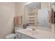 Bathroom features a mirror, vanity, toilet, shower with curtain and neutral tile flooring at 5912 Hourglass Ct, Raleigh, NC 27612