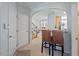 Charming entryway with arched doorway, breakfast bar, and staircase to the upper level at 5912 Hourglass Ct, Raleigh, NC 27612