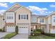 Charming townhome with a well-manicured lawn, attached garage, and beautiful landscaping at 5912 Hourglass Ct, Raleigh, NC 27612