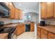 Well-equipped kitchen with plenty of counter space, wooden cabinets, and modern appliances at 5912 Hourglass Ct, Raleigh, NC 27612