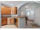 Traditional kitchen with wooden cabinets, breakfast bar, and neutral countertops at 5912 Hourglass Ct, Raleigh, NC 27612