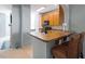 Functional kitchenette with a breakfast bar, ample counter space, and modern appliances at 5912 Hourglass Ct, Raleigh, NC 27612
