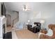 Cozy living room with a fireplace, comfortable seating, and a staircase to the upper level at 5912 Hourglass Ct, Raleigh, NC 27612