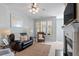 Inviting living room with a fireplace, comfortable seating, and abundant natural light at 5912 Hourglass Ct, Raleigh, NC 27612