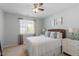 Bright main bedroom with white furniture and a window with natural light at 5912 Hourglass Ct, Raleigh, NC 27612