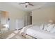 Bright bedroom with ensuite bathroom and large closet featuring white furniture at 5912 Hourglass Ct, Raleigh, NC 27612