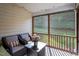 Relaxing screened-in patio with comfortable seating and views of the lush backyard at 5912 Hourglass Ct, Raleigh, NC 27612