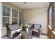 Relaxing screened-in porch with comfortable seating and stylish decor at 5912 Hourglass Ct, Raleigh, NC 27612