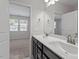Bathroom with double vanity featuring white countertops and light gray walls at 709 Wickham Ridge Rd, Apex, NC 27539