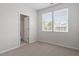Bedroom with neutral carpet, light gray walls, and an ensuite bathroom at 709 Wickham Ridge Rd, Apex, NC 27539