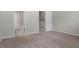 Bedroom features neutral carpet and light gray walls leading into ensuite bathroom at 709 Wickham Ridge Rd, Apex, NC 27539