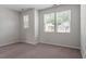 Bedroom with neutral carpet and light gray walls boasting natural light from windows at 709 Wickham Ridge Rd, Apex, NC 27539