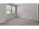 Bedroom with neutral carpet, light gray walls, and double windows at 709 Wickham Ridge Rd, Apex, NC 27539