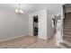 Spacious area featuring hardwood floors, crown molding, and ample lighting, perfect for entertaining at 709 Wickham Ridge Rd, Apex, NC 27539