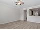 Bright living room with modern floors and view to kitchen at 709 Wickham Ridge Rd, Apex, NC 27539